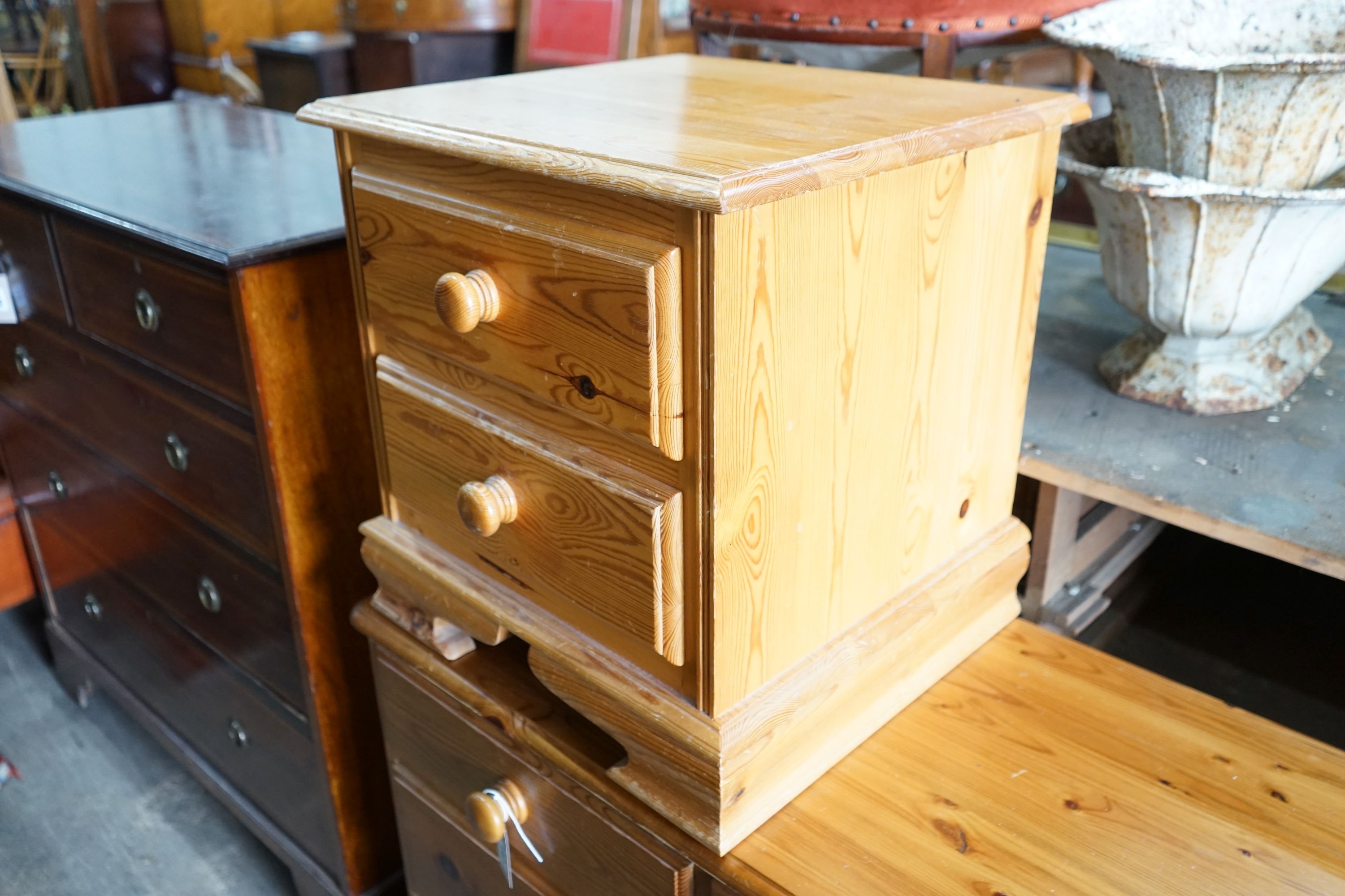 A modern pine double chest, width 192cm, depth 44cm, height 71cm and a similar two drawer bedside chest